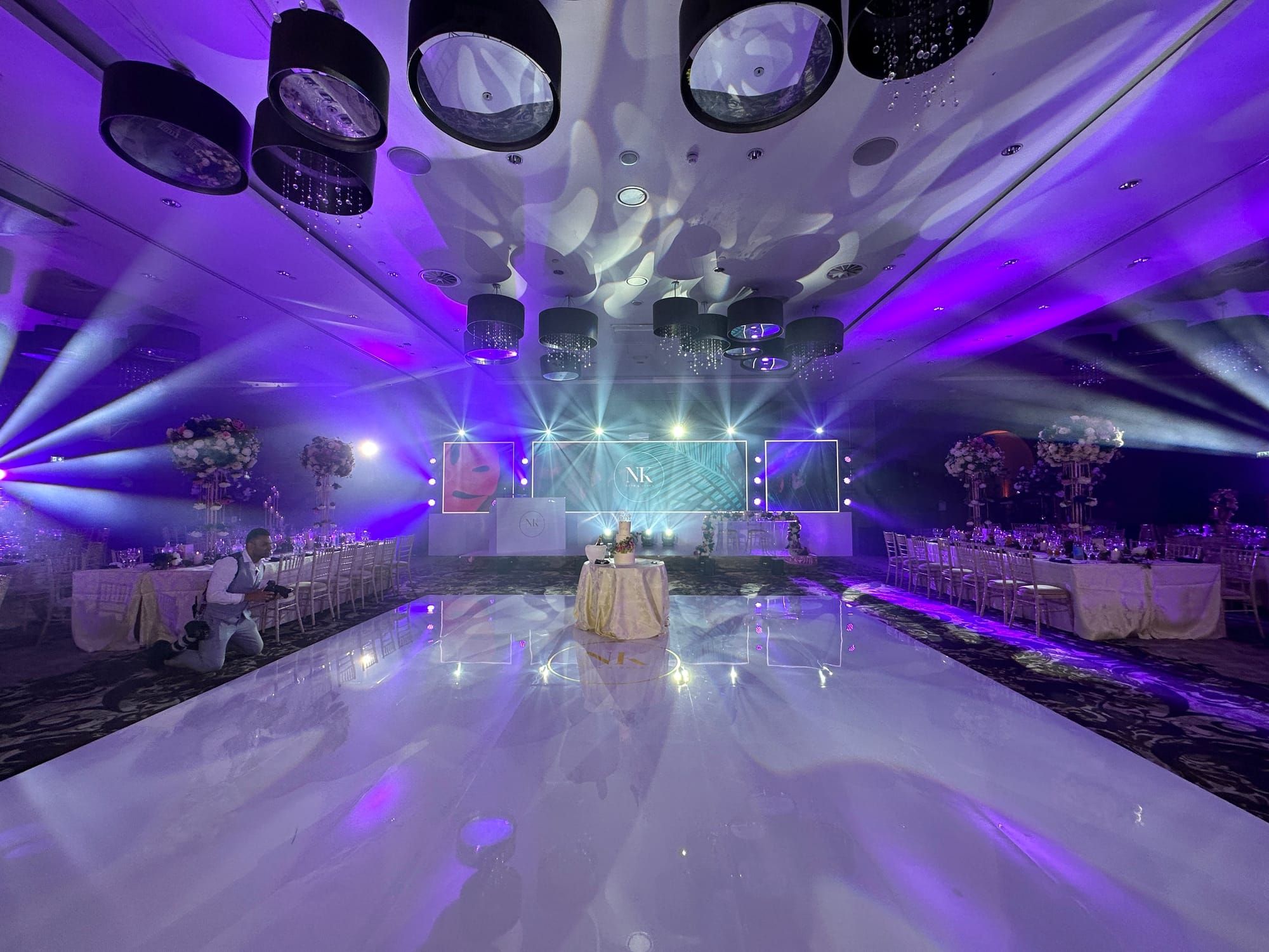 An Avari Events install in progress, a stage set part-dressed with lighting rigged above it