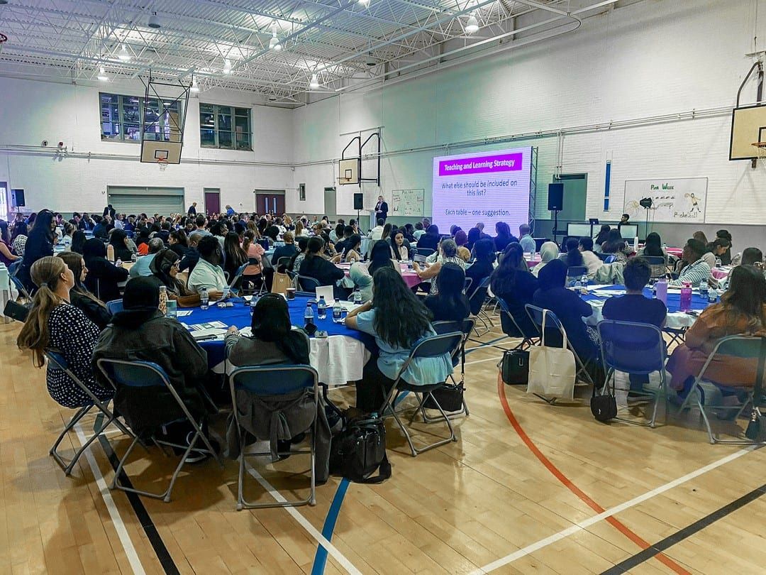 A school hall of round tables during a student event