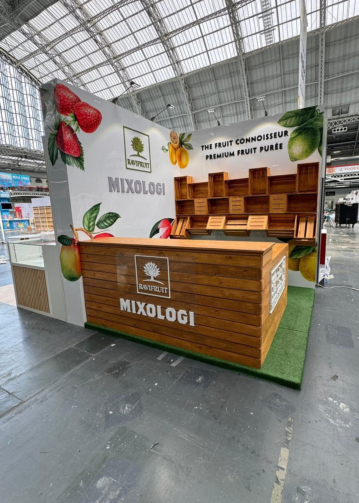 A timber exhibition bar built for a fruit purée brand, printed panels behind